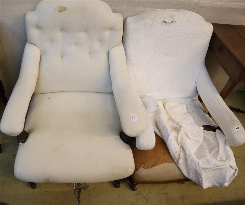 A near pair of late Victorian upholstered open armchairs